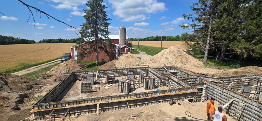 Concrete walls being poured for a residential home addition in Eastern Wisconsin by Van Wyks Inc.
